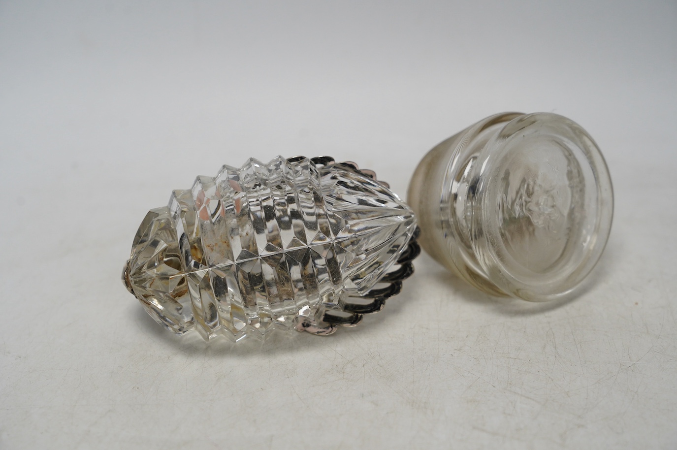 A white metal mounted glass match strike and a silver mounted swan bon bon dish, 10cm. Condition - poor to fair